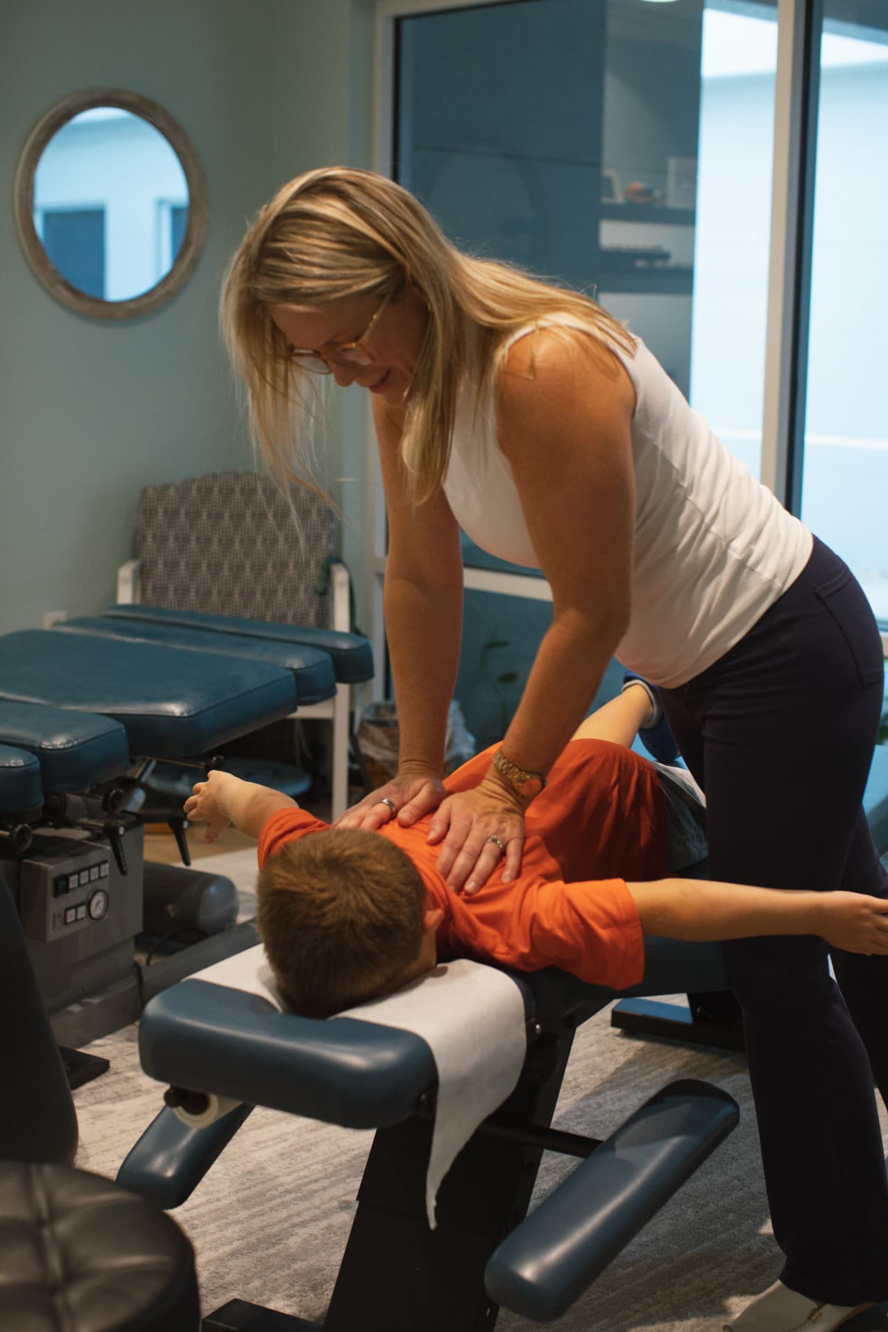 Dr. Lindsay Dodd providing gentle pediatric chiropractic care in Naples, FL